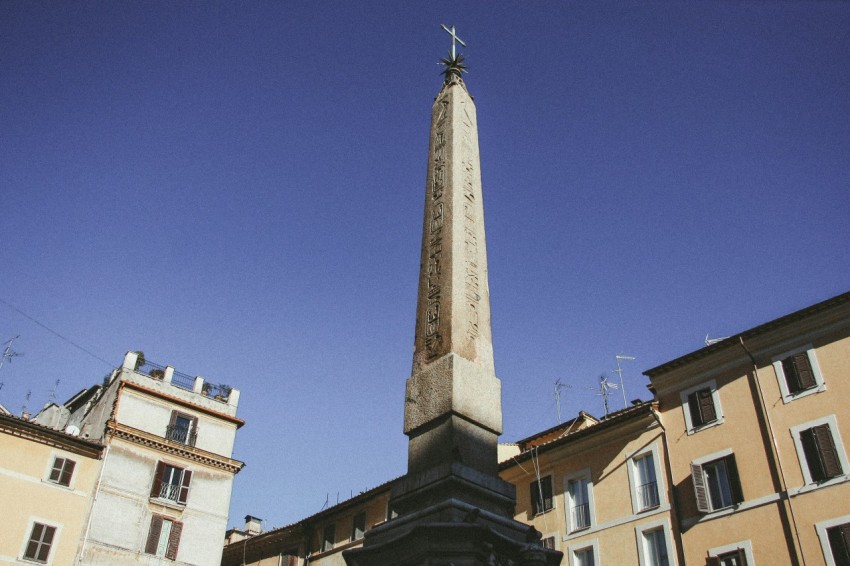 white concrete tower under blue sky during daytime