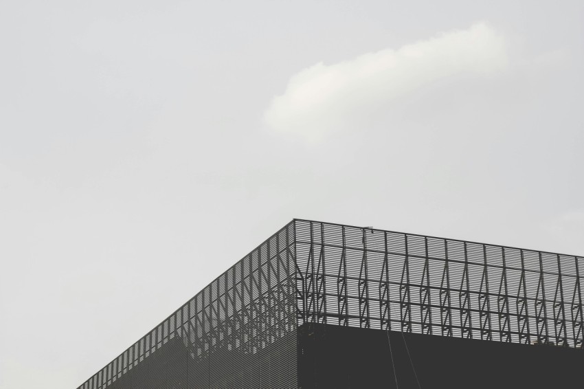 grayscale photo of curtainwall building