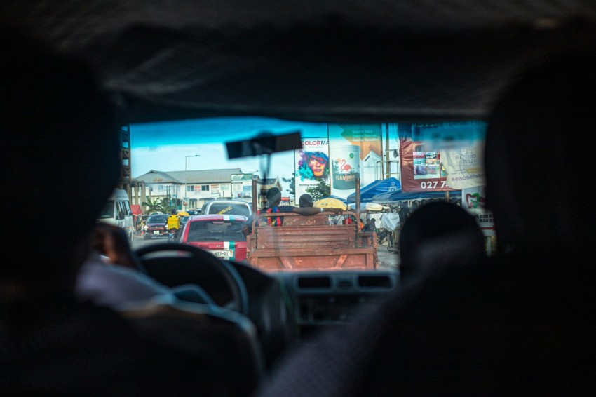 a view of a street from inside a vehicle