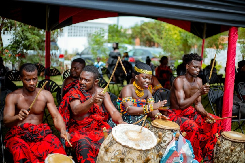 a group of people playing drums