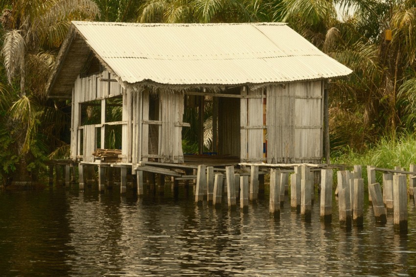 a house on stilts in a body of water