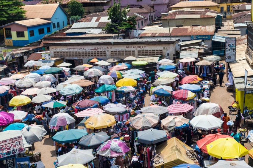 a large crowd of people are holding umbrellas