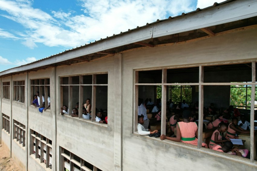 a group of people standing outside of a building