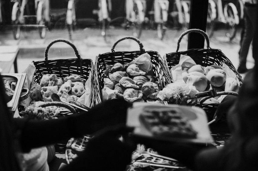 grayscale photo of basket of fruits