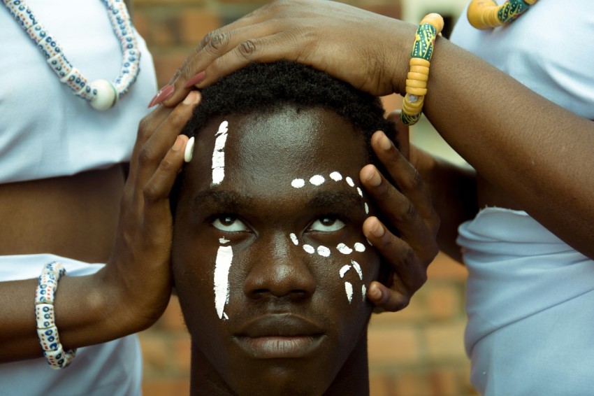 a woman with white paint on her face