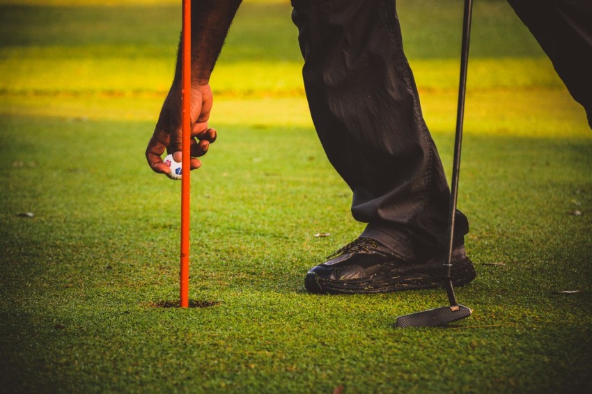 a person holding a golf club