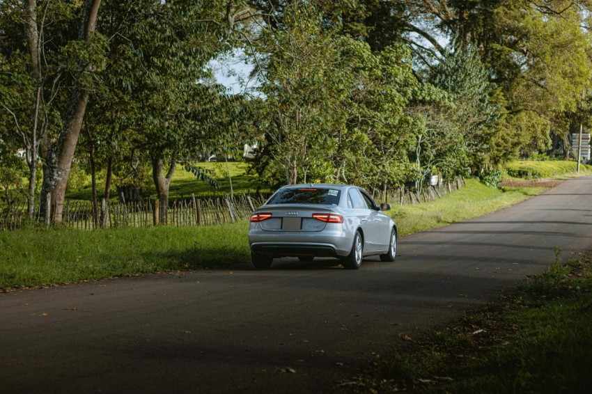 a car is parked on the side of the road tffN2