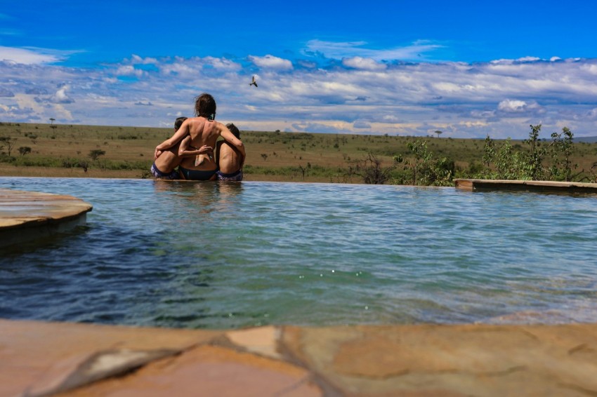 a couple of people that are sitting in a pool