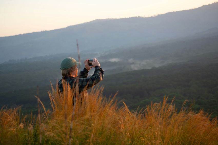 a person taking a picture with a camera