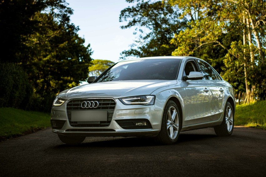 a silver car parked on the side of a road