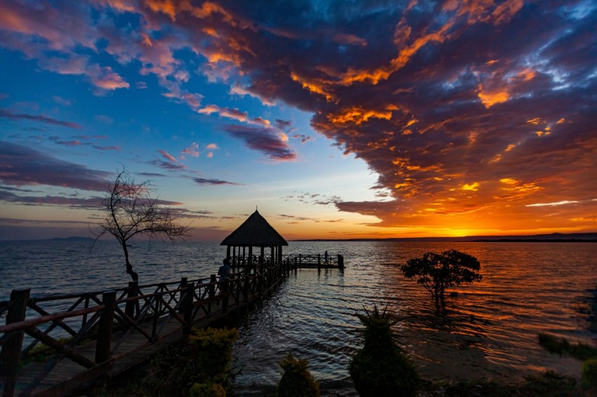 a dock with a gazebo in the middle of the water