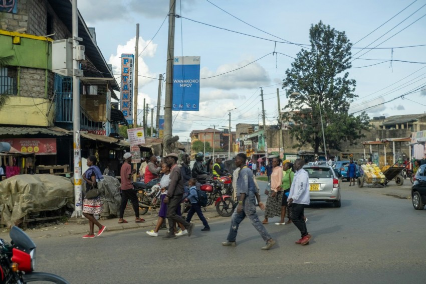 a group of people walking down a street