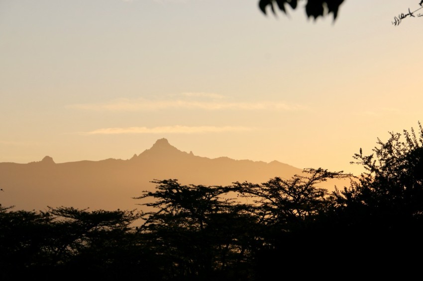 a view of a mountain range at sunset