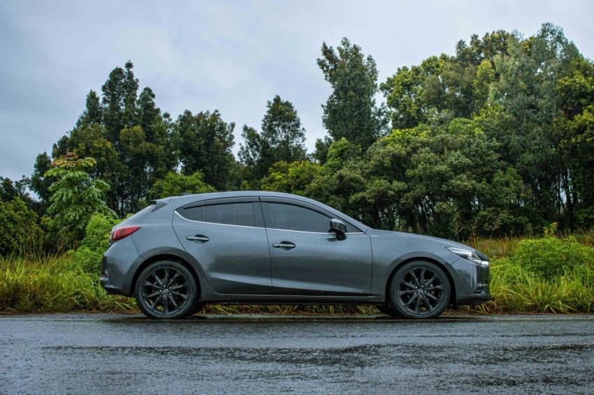 a gray car parked on the side of the road