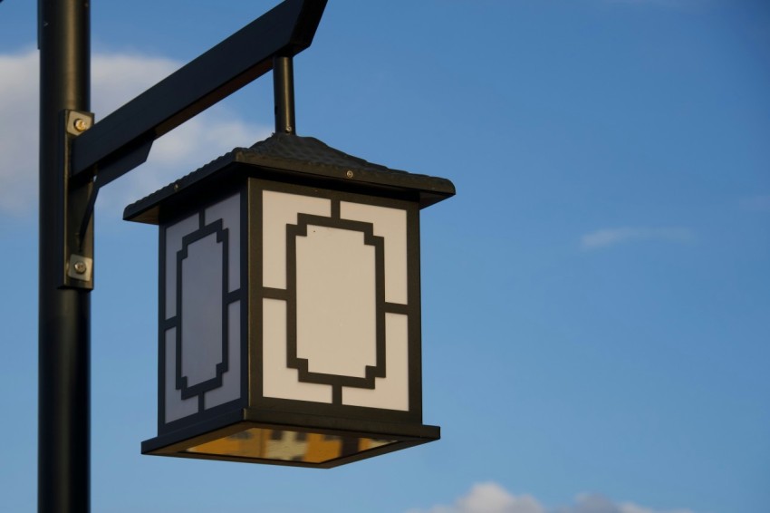 a street light with a blue sky in the background