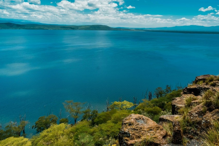 blue body of water under blue sky during daytime T