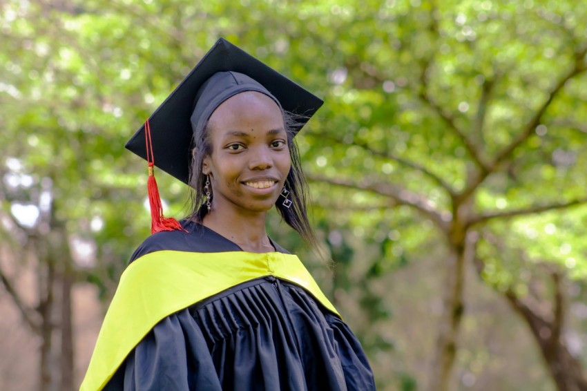 a woman in a graduation cap and gown