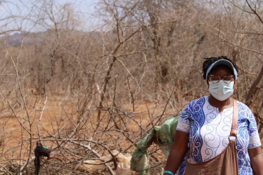 a woman wearing a face mask and gloves