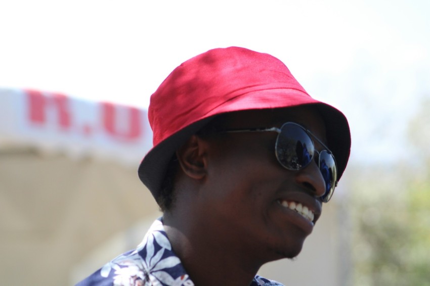 a woman wearing a red hat and sunglasses