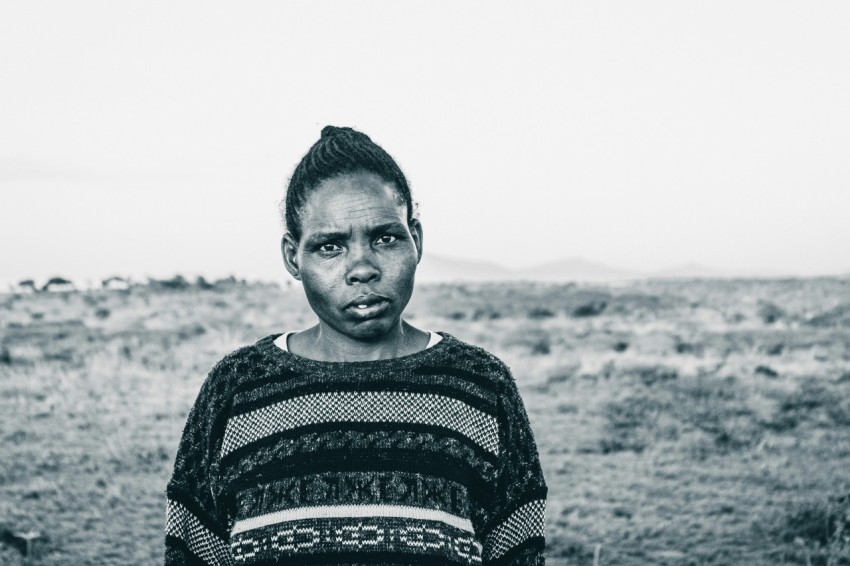 grayscale photo of woman in sweater