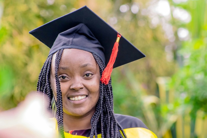 a woman in a graduation cap and gown