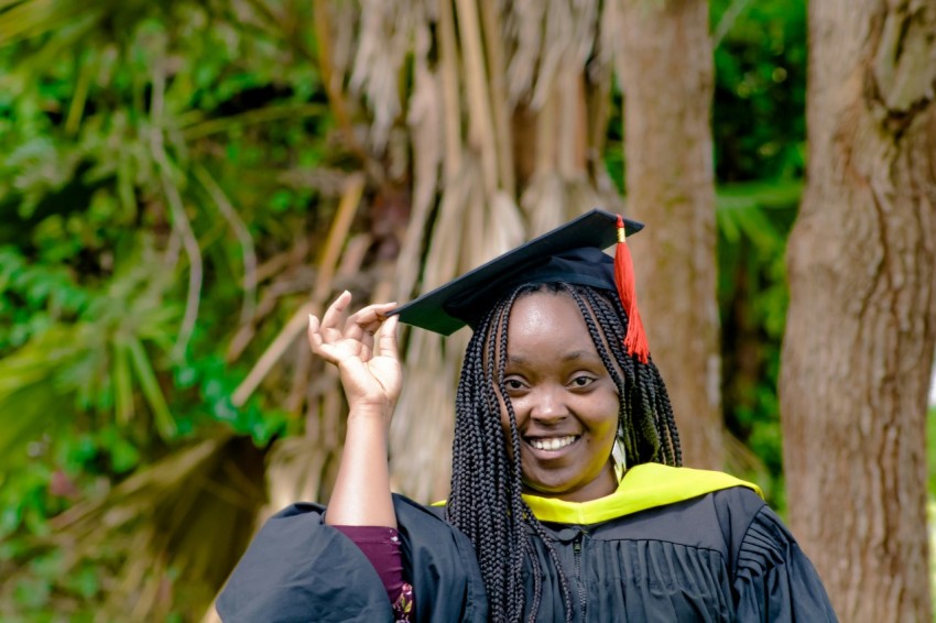 a woman in a graduation cap and gown