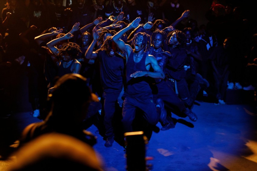 a group of people that are standing in the dark