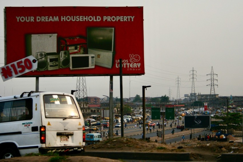 a large billboard on the side of a road