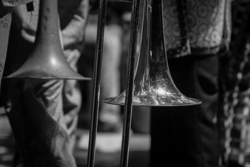 brass trumpet on black textile