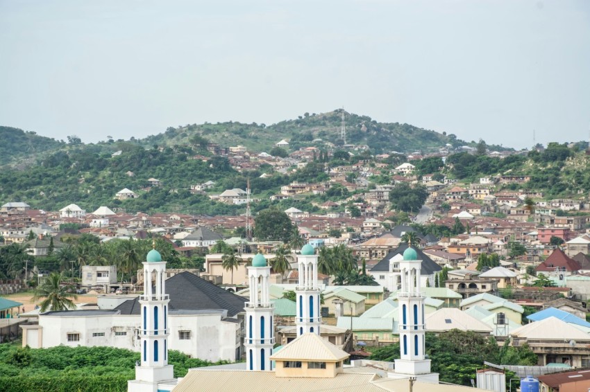 a view of a city with a hill in the background