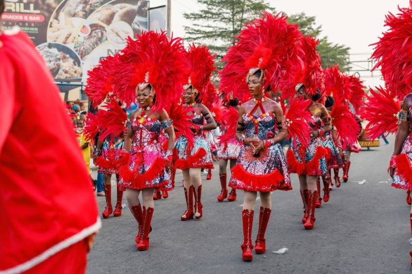 a group of women in red and pink costumes