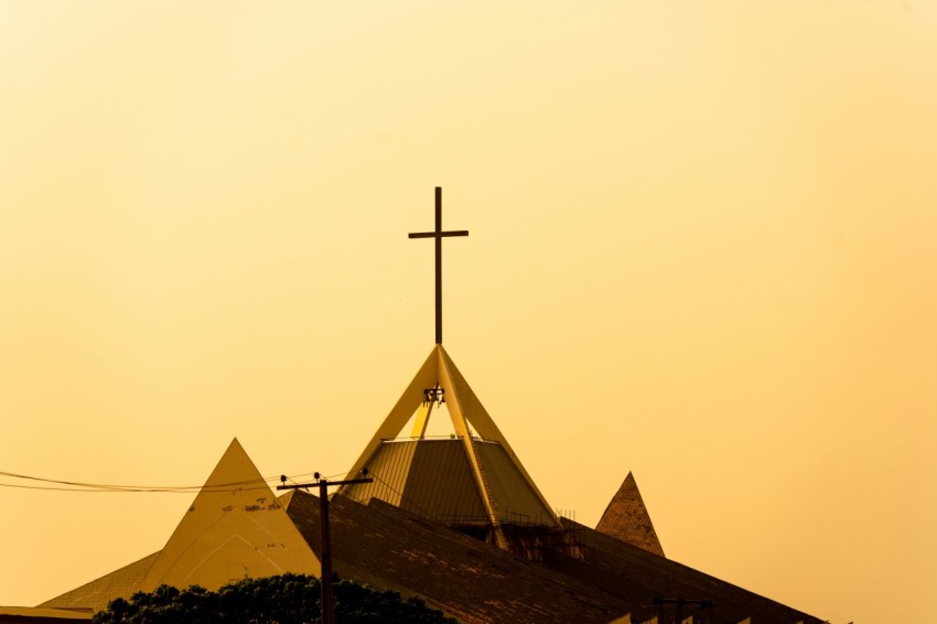 a church steeple with a cross on top