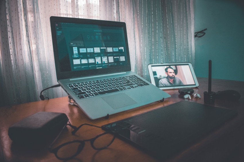 macbook pro on brown wooden table