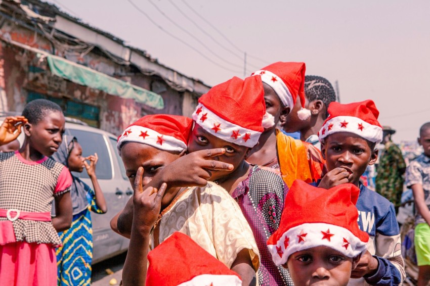 a group of people wearing red and white hats