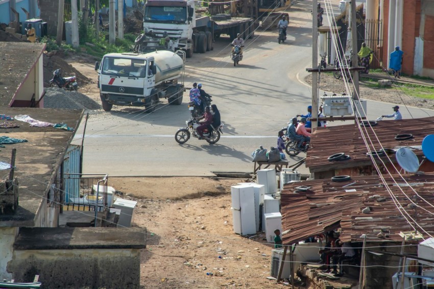 a group of people riding motorcycles on a road