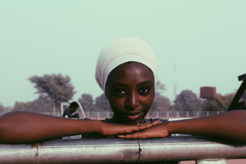 woman in white cap and white shirt