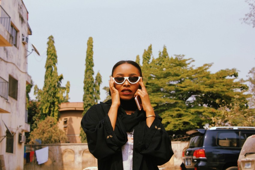 woman wearing sunglasses and black jacket