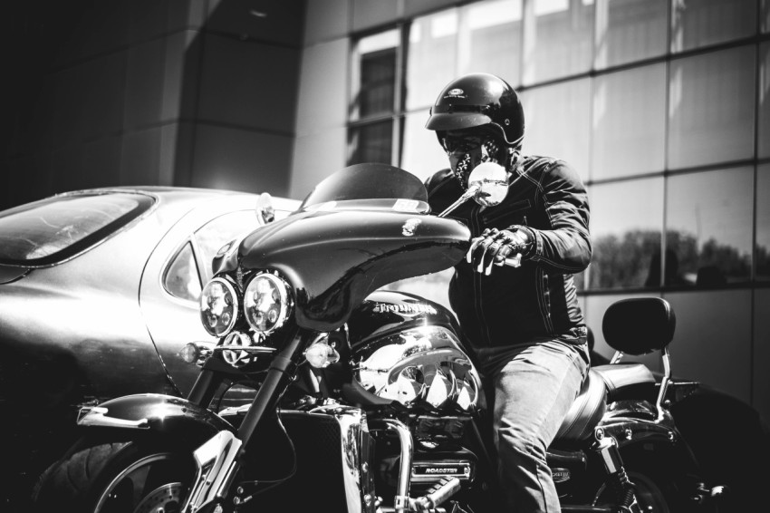 grayscale photo of man riding motorcycle NPtxHsA