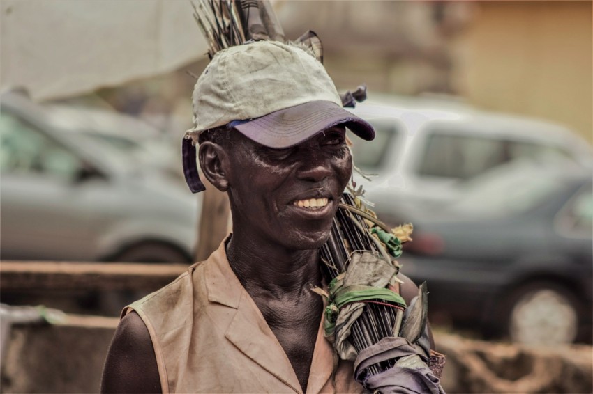 focus photography of man wearing curved brimmed cap