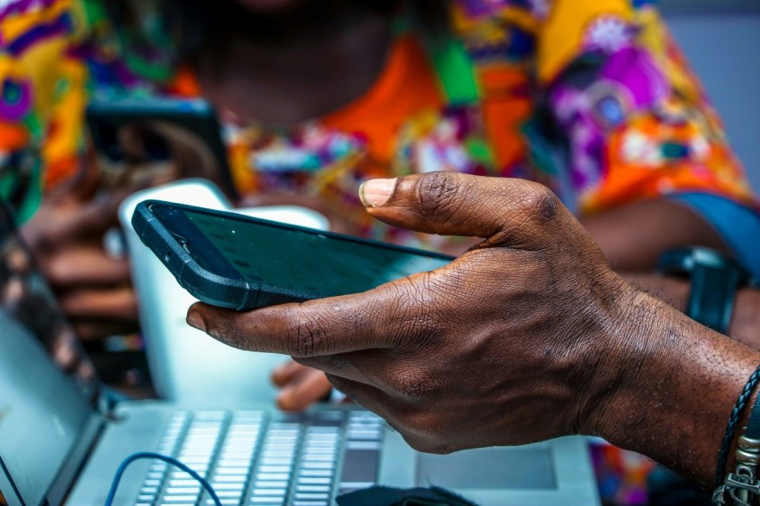 shallow focus photo of person holding black android smartphone