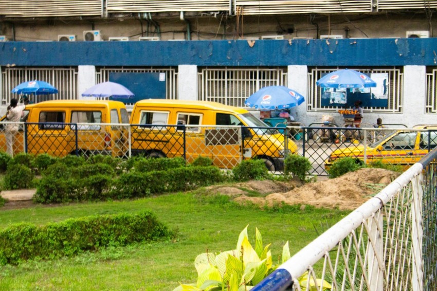 yellow bus on gray concrete road during daytime vJJ2lVvK