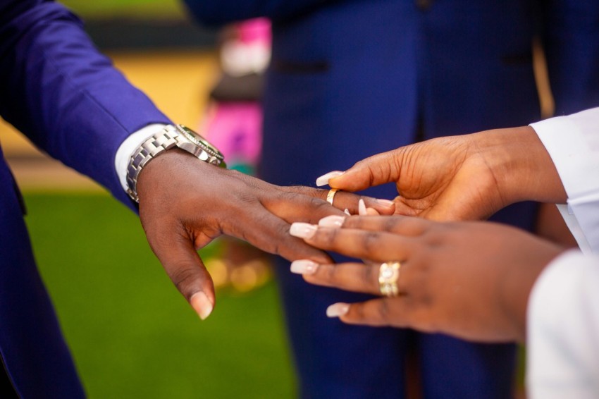 a close up of a person holding another persons hand