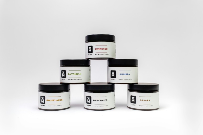 a group of five jars of body butter on a white background