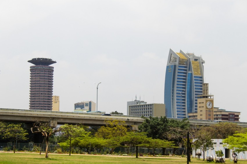 a city skyline with tall buildings in the background