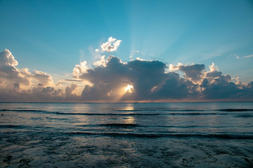 ocean under blue and white cloudy sky during daytime F