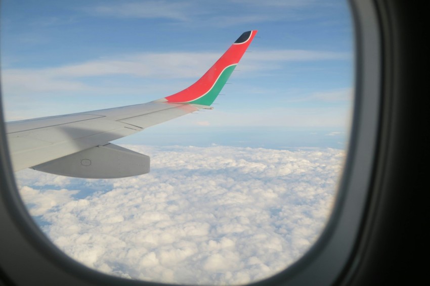 white pink and green airplane window viewed from a window