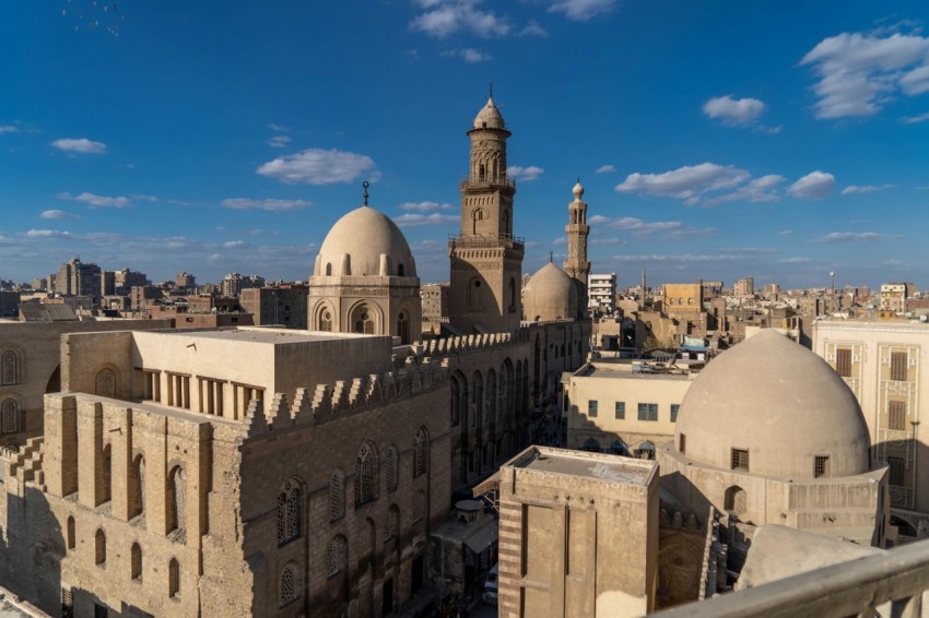 a view of a city from a rooftop of a building ellq3Pc