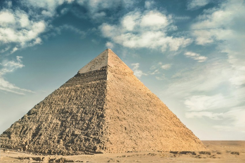 a very tall pyramid sitting in the middle of a desert