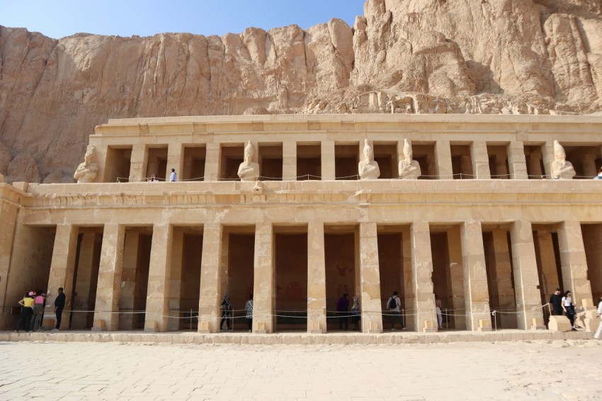 a group of people standing in front of a large building