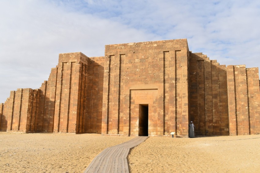 a large brick building with a walkway leading to it n4Wgqbem